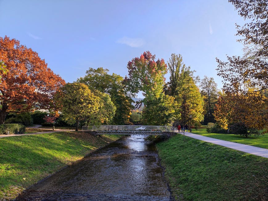 Autumn foliage and a footbridge over the Oos in a Baden-Baden park