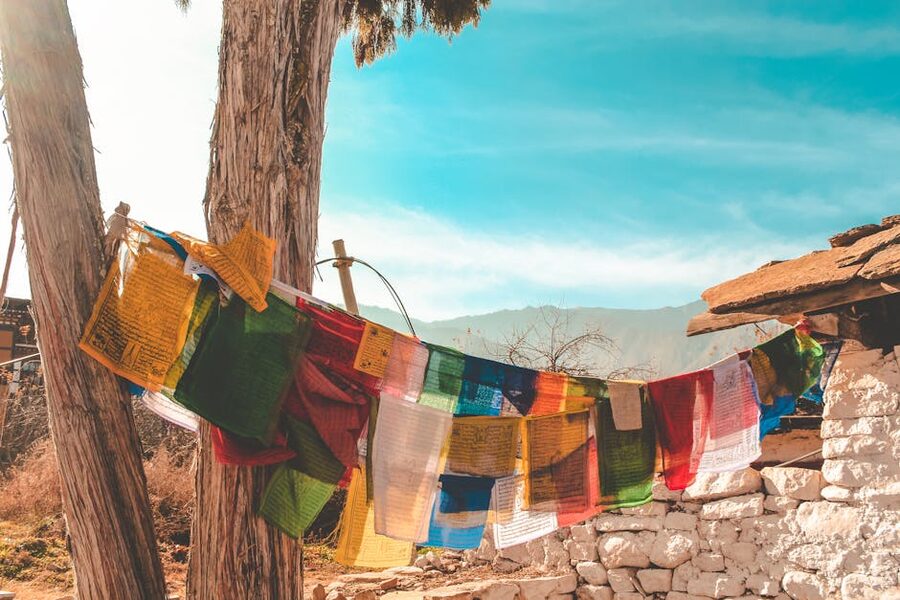 Prayer flags strung across a Bhutanese mountain pass