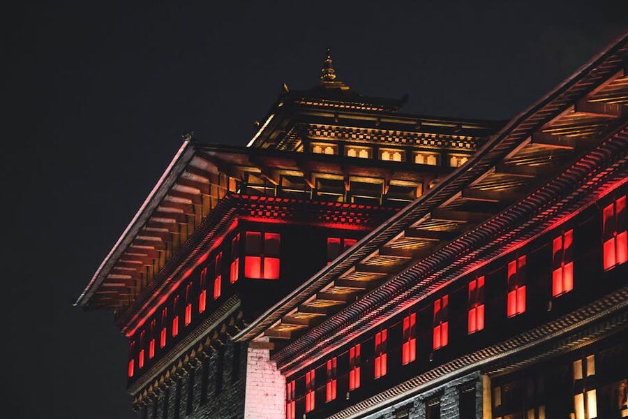 Traditional Bhutanese architecture lit at night in Thimphu