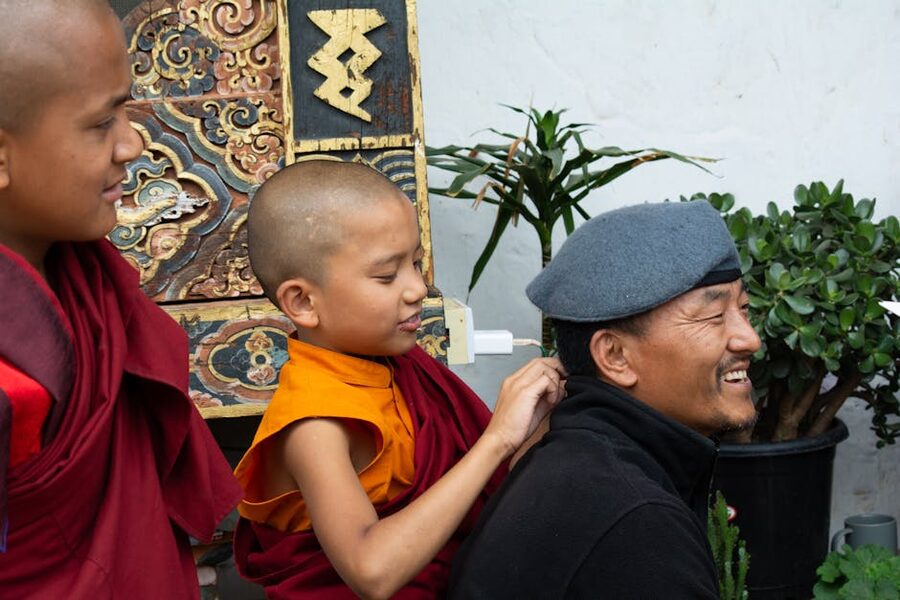 Young Buddhist monks laughing together in Bhutan