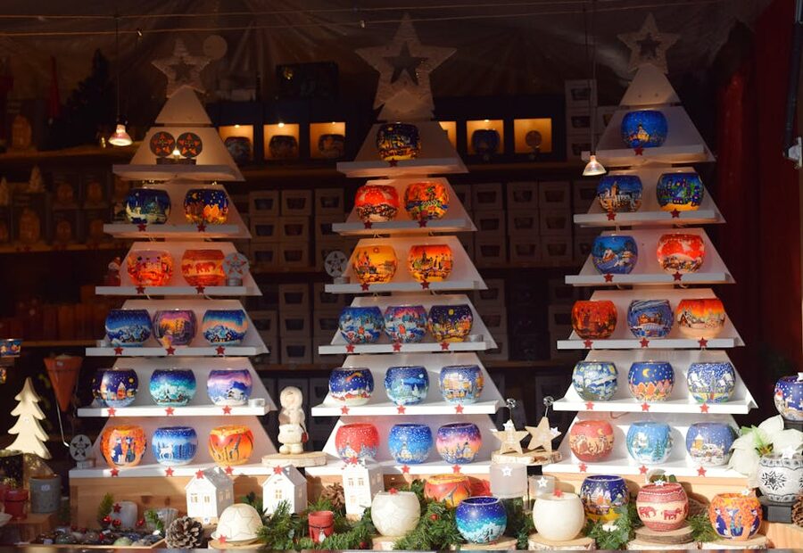 Strasbourg Christmas market candle display with lit votives and wooden stall decorations