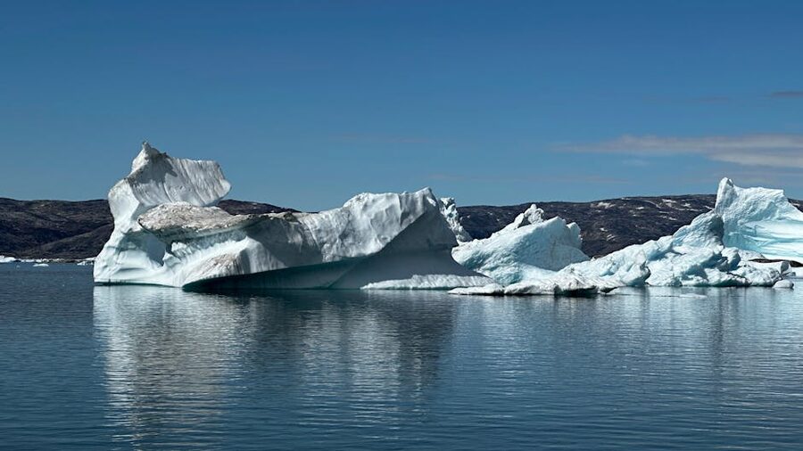 Massive icebergs floating in calm Greenlandic waters