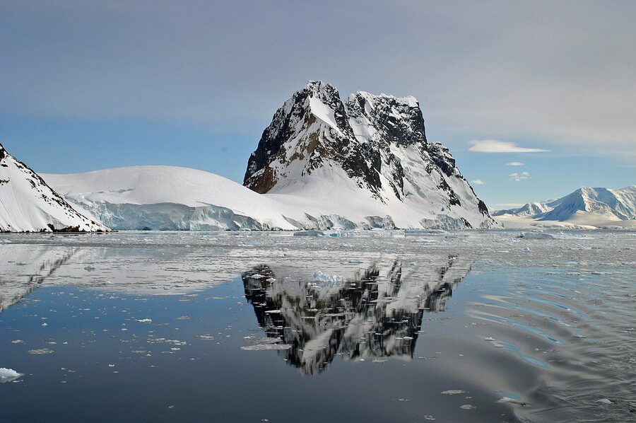 Lemaire Channel in the Antarctic Peninsula with steep snow-capped walls and floating ice