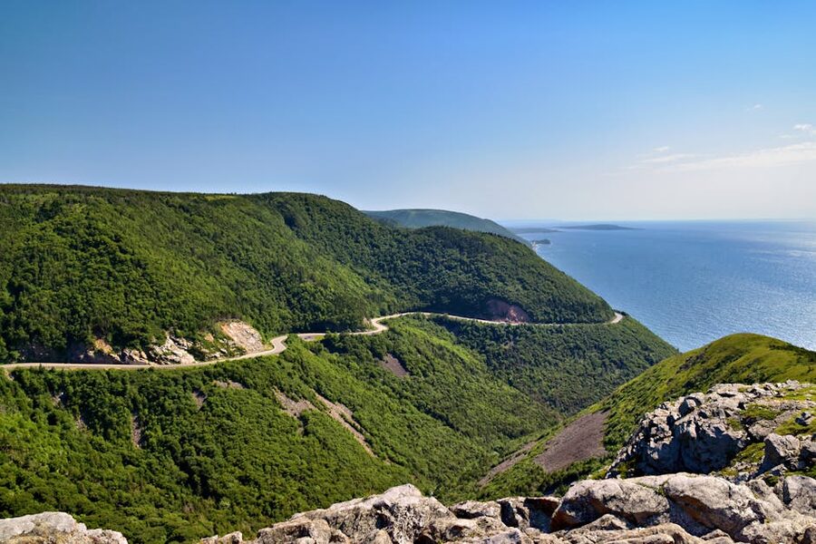 The Cabot Trail winding through hills and coastline in Cape Breton