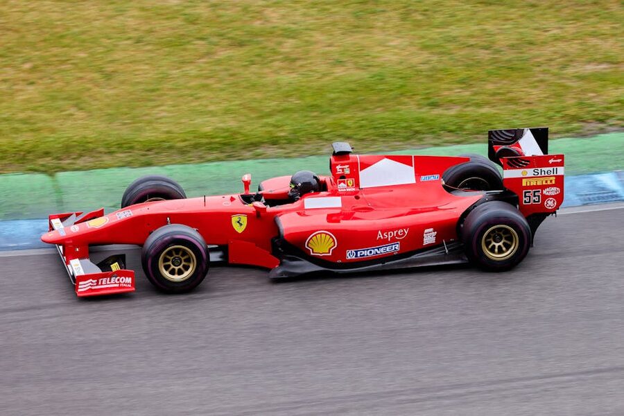 A Ferrari Formula 1 car in motion on a race track