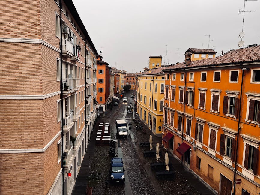 Modena street view with colourful buildings and arcades