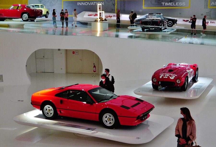 Vintage Ferrari cars displayed inside the Museo Enzo Ferrari in Modena