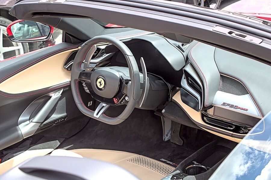 A Ferrari SF90 Spider hybrid hypercar parked outdoors