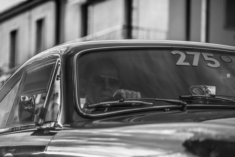 A vintage car on the Mille Miglia route through Brescia