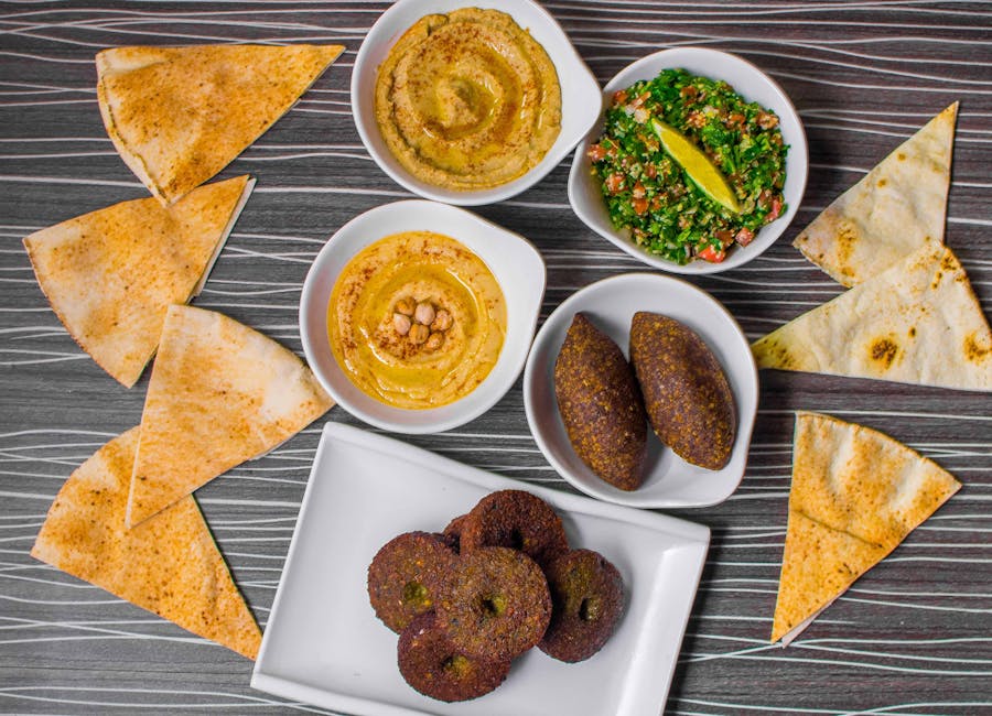 Top view of Lebanese meze platter with hummus, fattoush, and small dishes