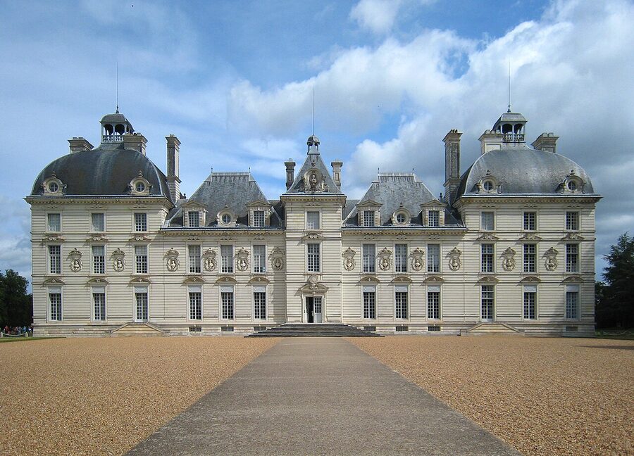 Chateau de Cheverny seen from the gardens, white stone facade with steep slate roof