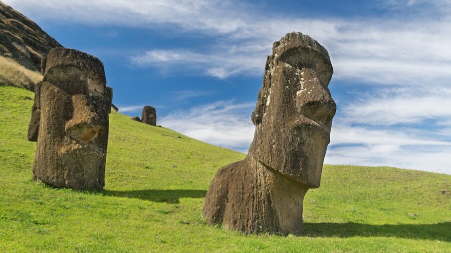Moai statues on Easter Island under blue sky