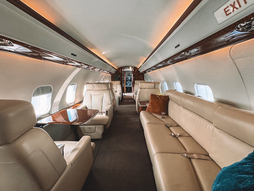 Private jet cabin interior with leather flatbed seats