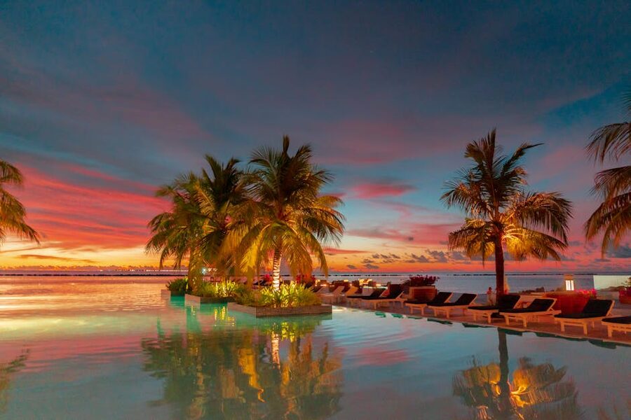 Luxury infinity pool at sunset overlooking the sea