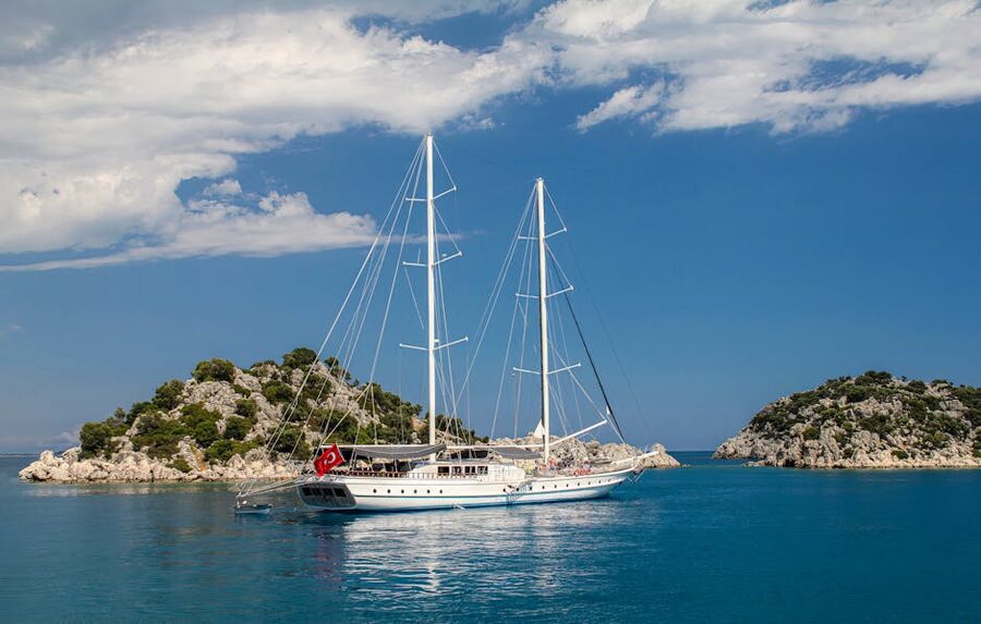 Sailing yacht anchored near rocky islands in Antalya, Turkiye