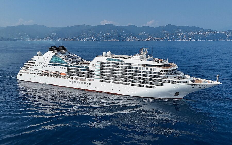 The Seabourn Ovation, an Encore-class luxury cruise ship, anchored off Portofino, Italy