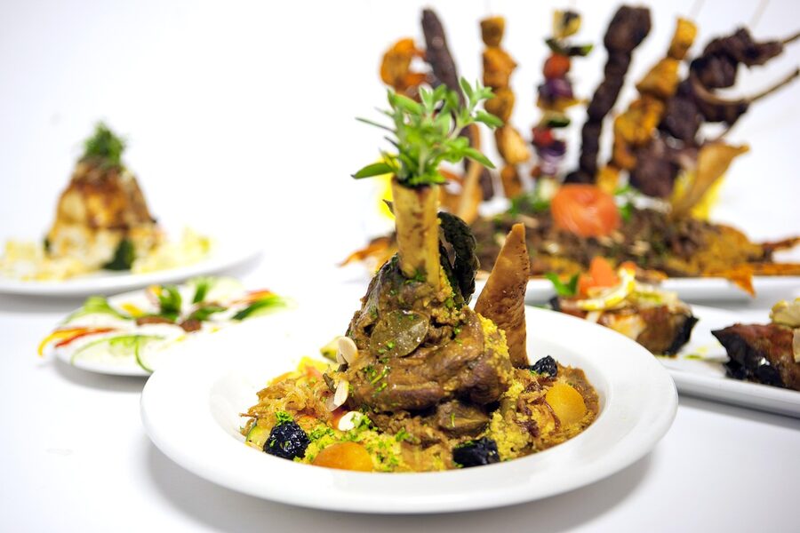 Lamb tagine with prunes and almonds in a clay pot