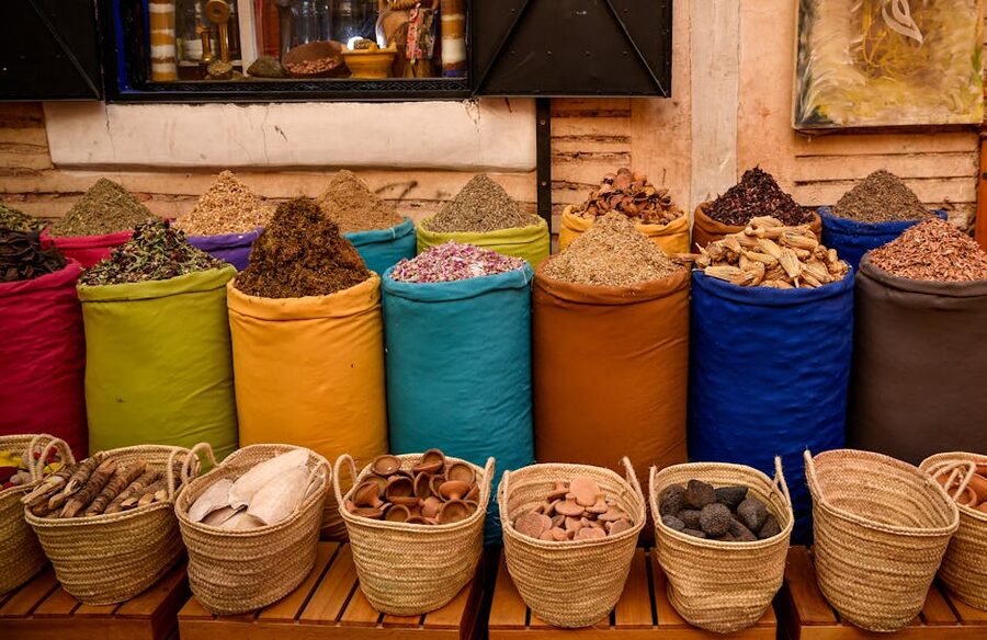 Marrakech souk spice stall with sacks of coloured spices