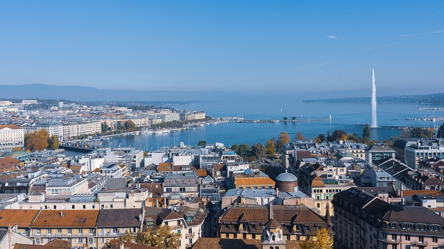 Geneva cityscape with Lake Geneva and Jet d'Eau in evening light