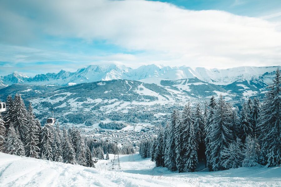 Winter landscape of Megeve France with snow-covered mountains and trees