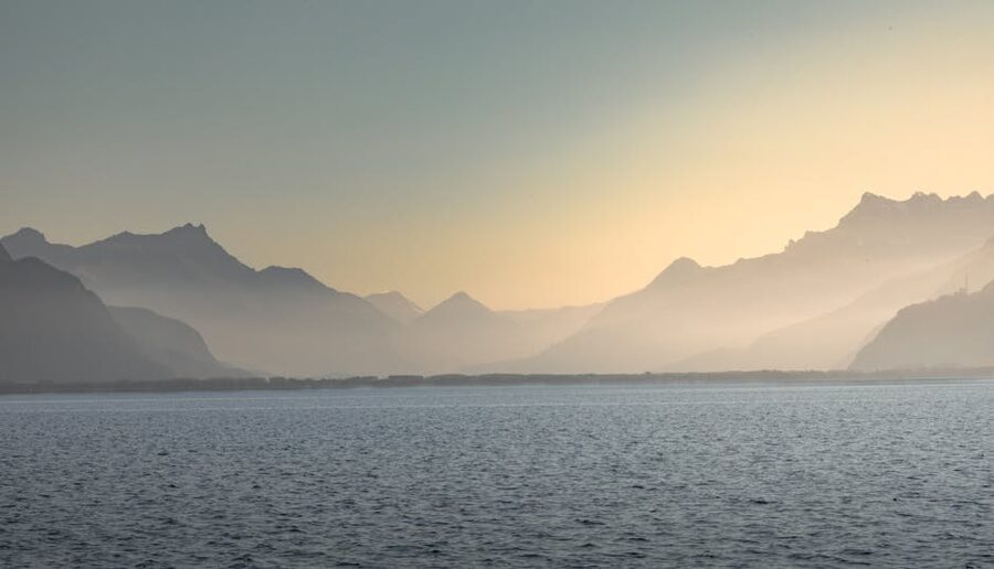 Misty mountains and Lake Geneva at sunset in Vevey Switzerland