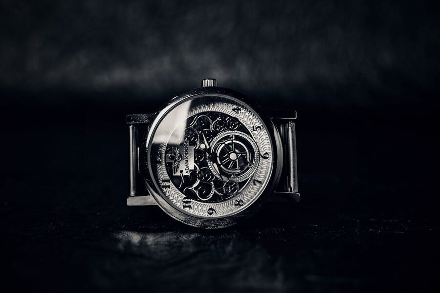 Close-up of a vintage mechanical watch movement showing intricate gears