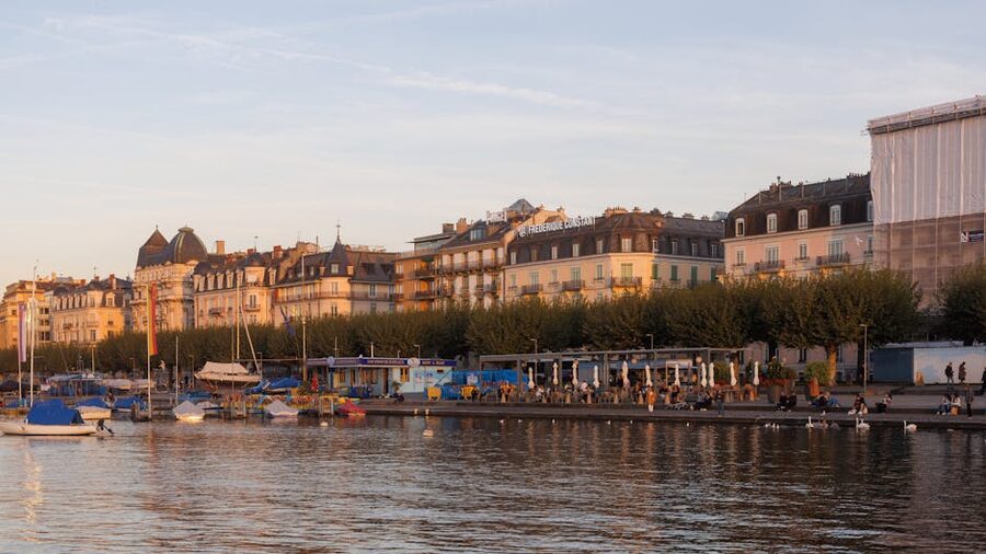 Geneva waterfront with historic buildings at sunset