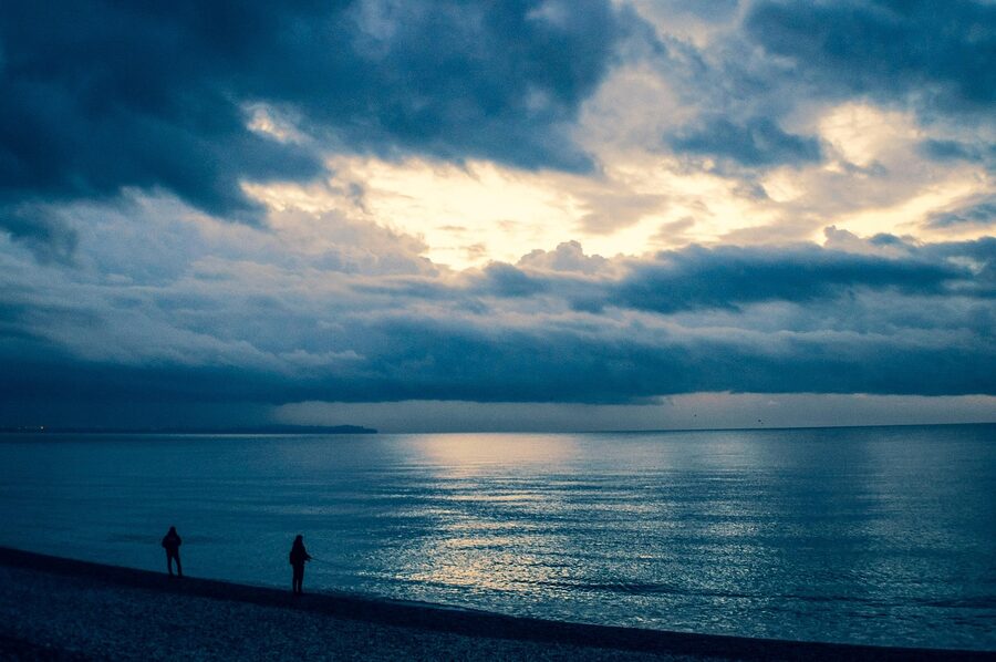 Antalya Konyaalti coast at sunrise with fishermen