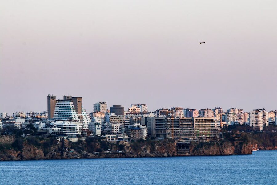 Antalya skyline at dusk across the sea