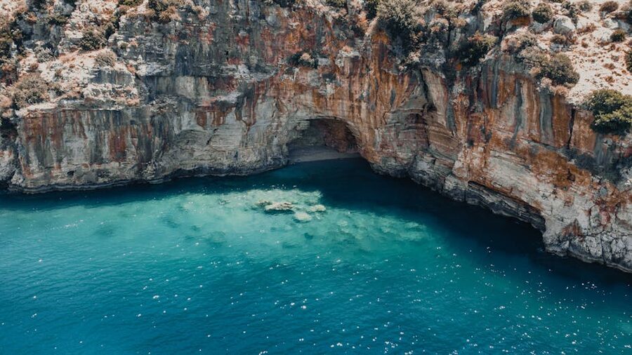Turquoise cove with rocky cliffs near Finike, Antalya, Turkey