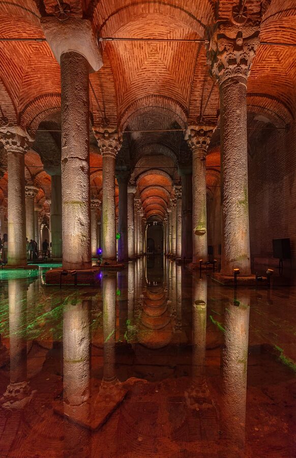 Interior of the Basilica Cistern in Istanbul with reflective water and lit columns